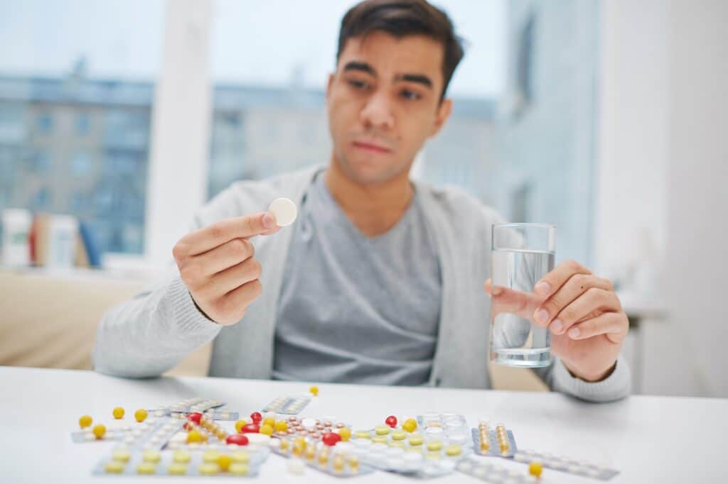 Man taking medications